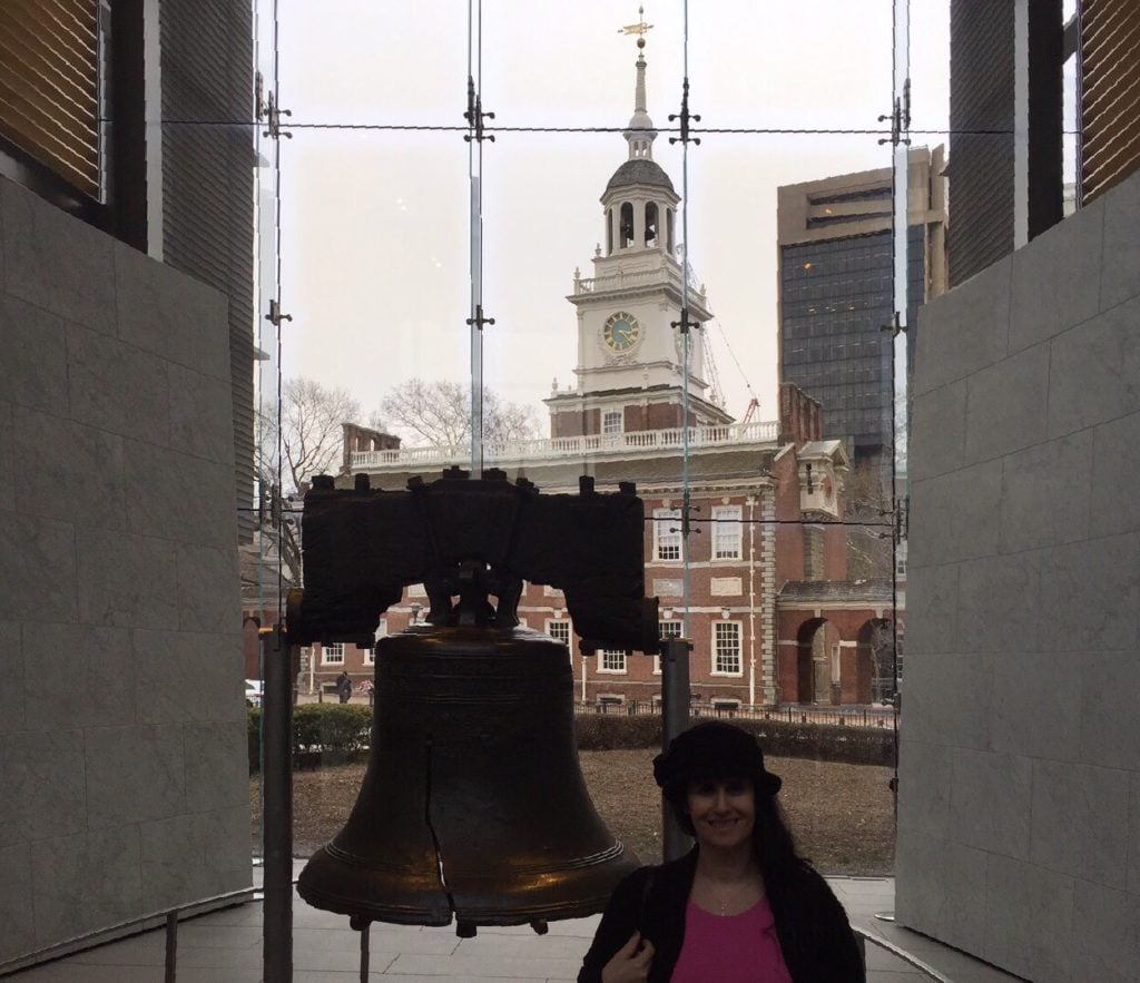 Anisa in Philadelphia with the Liberty Bell and Independence Hall in the background.